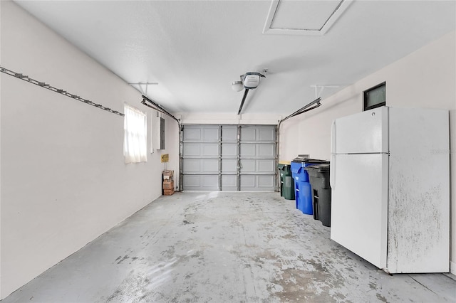 garage featuring white fridge