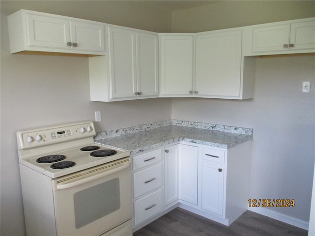 kitchen with white cabinets, dark hardwood / wood-style floors, light stone countertops, and white electric stove