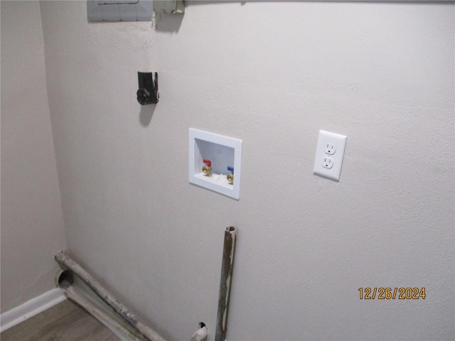 laundry area featuring washer hookup and hardwood / wood-style flooring