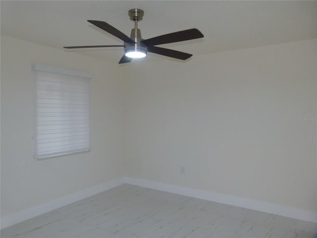 spare room with ceiling fan