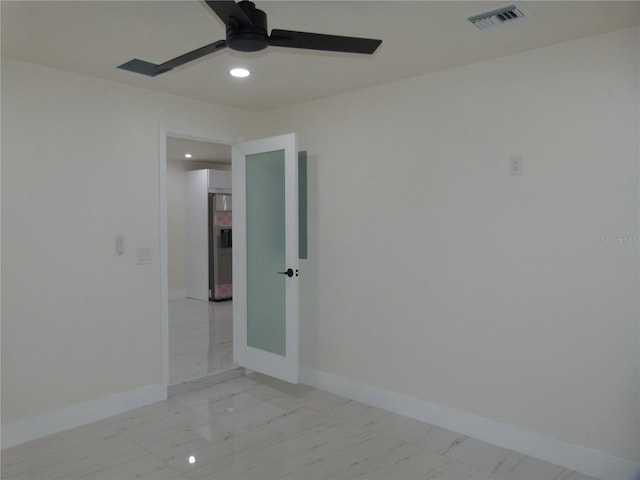 unfurnished room featuring ceiling fan