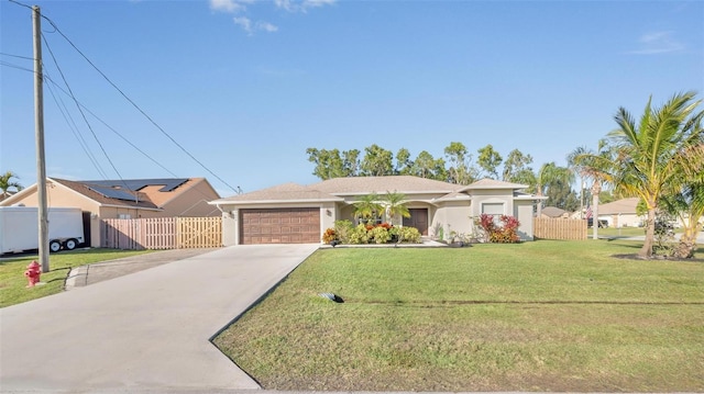 ranch-style home featuring a front lawn and a garage