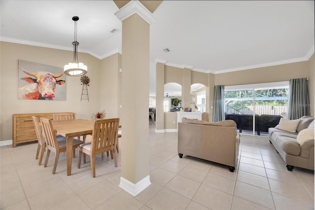 dining area featuring vaulted ceiling, ceiling fan, crown molding, and light tile patterned flooring