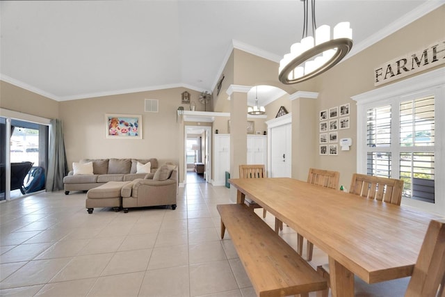 tiled dining area with an inviting chandelier, vaulted ceiling, and ornamental molding