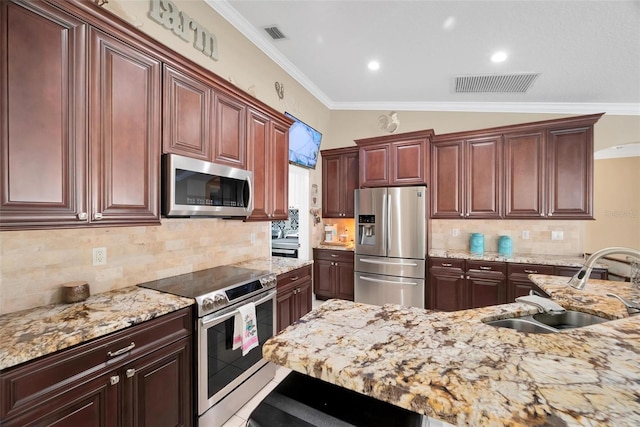 kitchen featuring appliances with stainless steel finishes, vaulted ceiling, ornamental molding, and sink