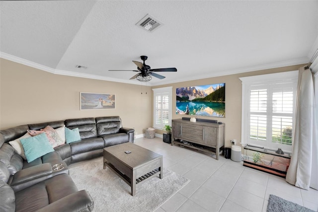 living room with a textured ceiling, vaulted ceiling, ceiling fan, crown molding, and light tile patterned floors