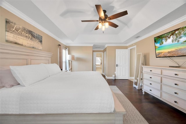 bedroom with dark hardwood / wood-style floors, a raised ceiling, ceiling fan, and ornamental molding