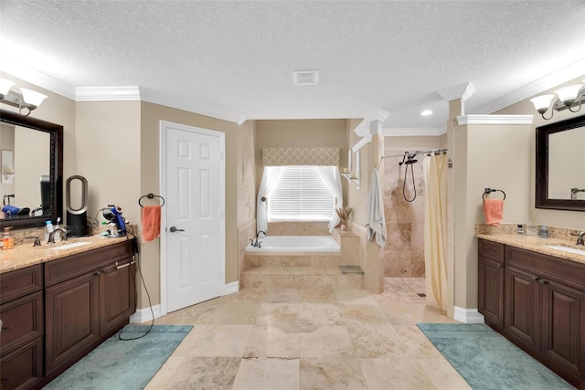 bathroom featuring a textured ceiling, vanity, crown molding, and plus walk in shower