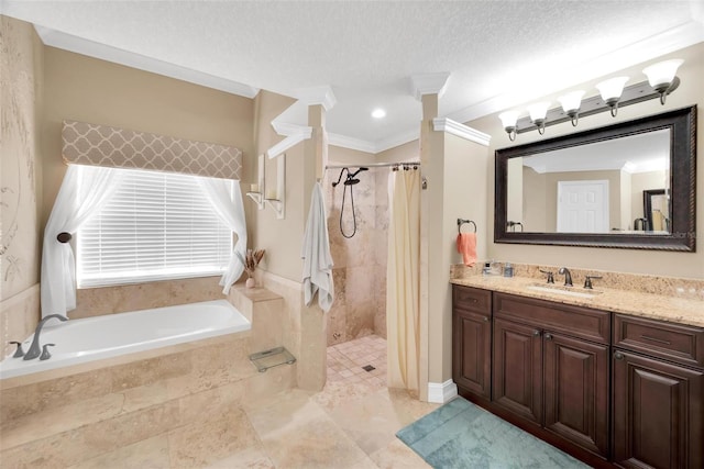 bathroom featuring a textured ceiling, vanity, separate shower and tub, and crown molding