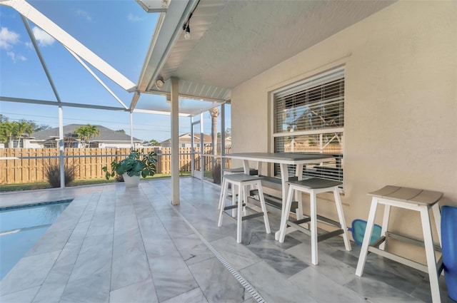 view of patio featuring a fenced in pool and a lanai