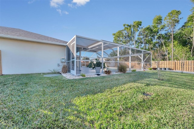 view of yard featuring glass enclosure