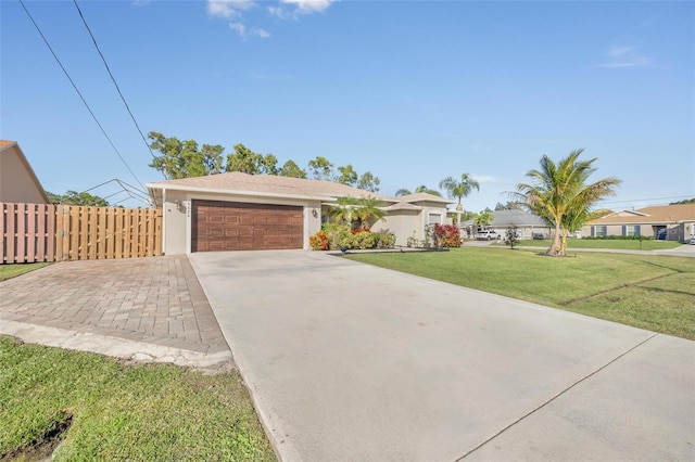 ranch-style home featuring a garage and a front lawn