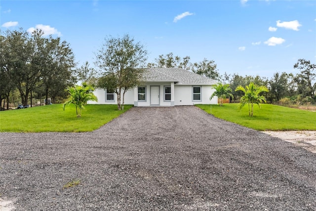 single story home with a front yard