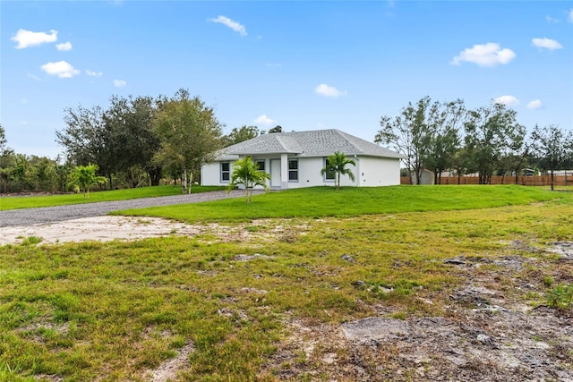 ranch-style home with a front yard