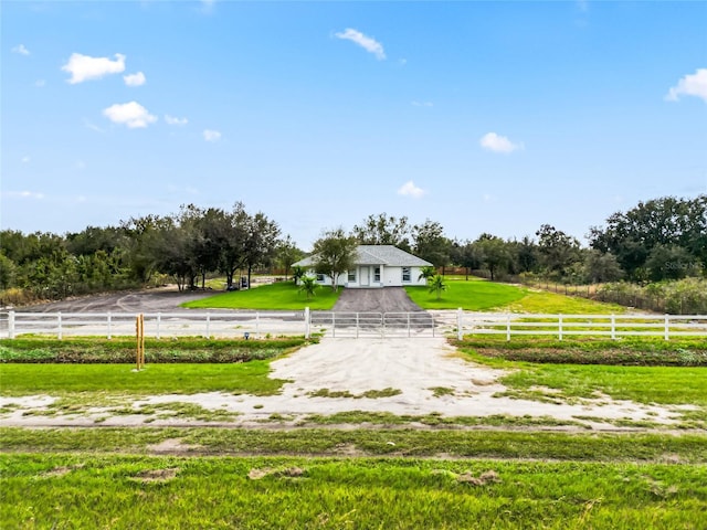 view of yard with a rural view