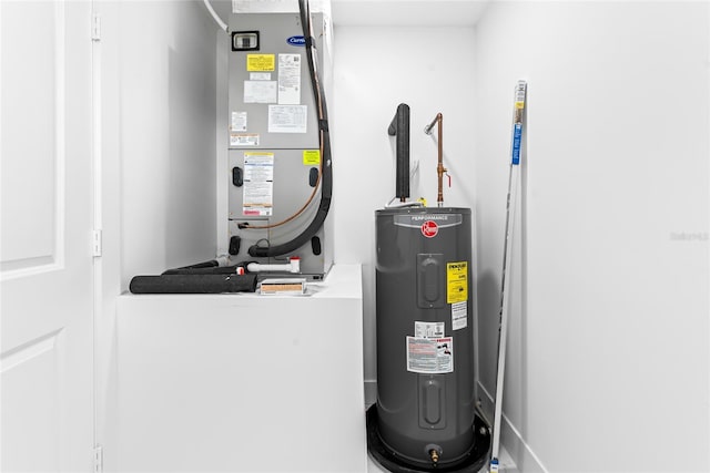 utility room featuring water heater