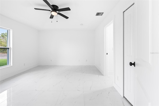 unfurnished room with ceiling fan