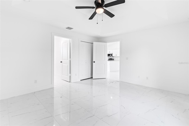 spare room with ceiling fan