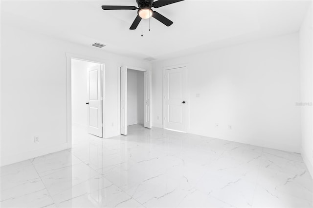 unfurnished room with ceiling fan