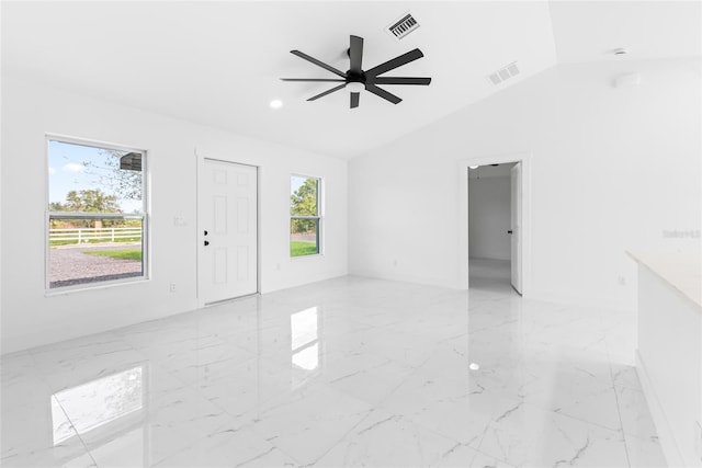 unfurnished living room with ceiling fan and lofted ceiling