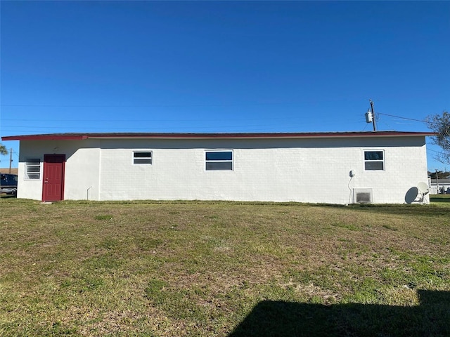 view of home's exterior with a yard