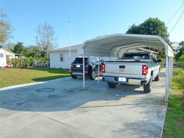 view of parking with a yard and a carport