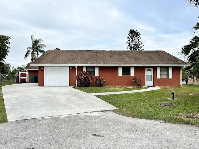 single story home featuring a garage and a front lawn