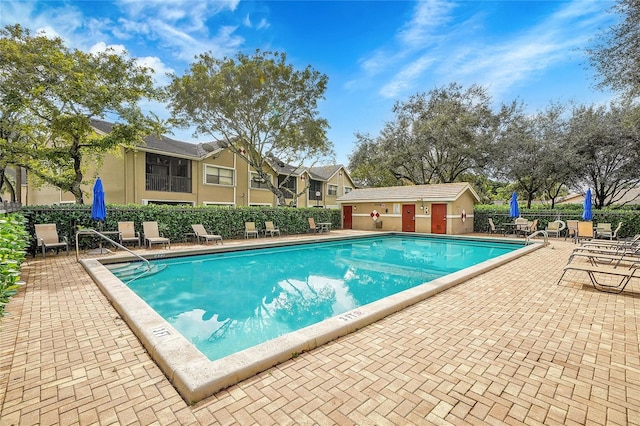 view of swimming pool with a patio area