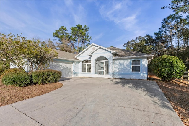 single story home featuring a garage