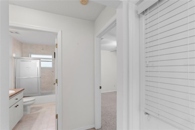 hallway featuring light tile patterned floors