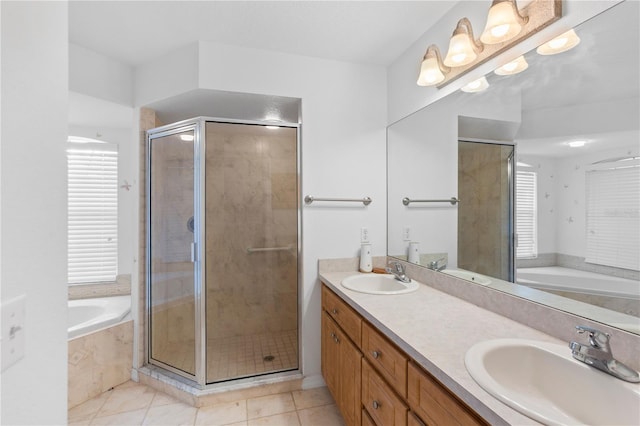 bathroom featuring tile patterned floors, shower with separate bathtub, and vanity