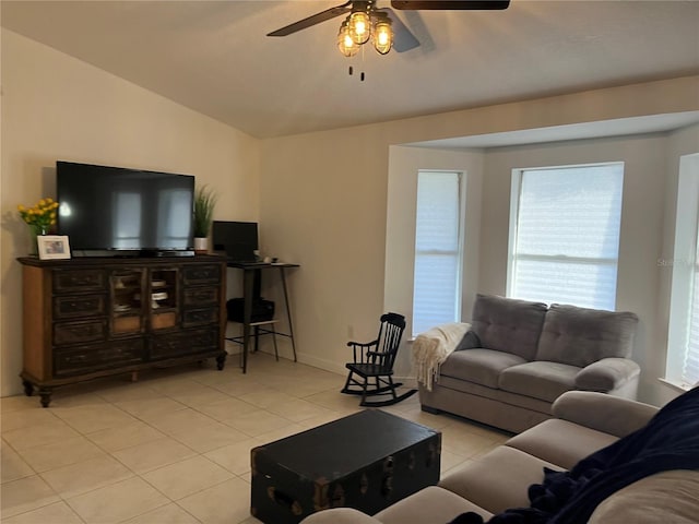 living room with light tile patterned flooring, lofted ceiling, and ceiling fan