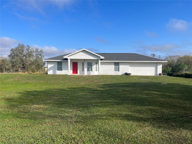 ranch-style home featuring a garage and a front yard