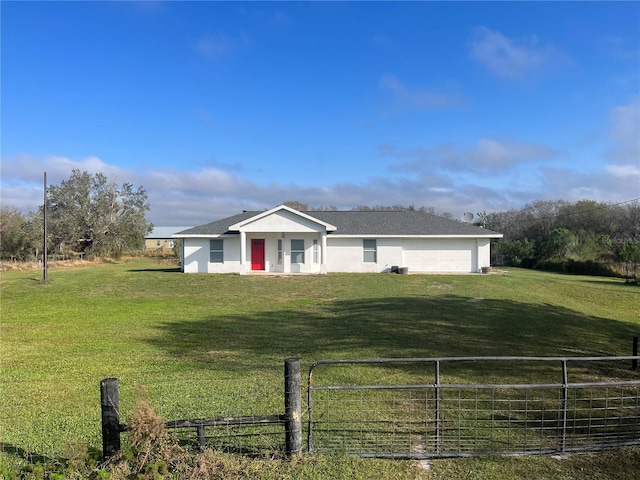 single story home featuring a garage and a front yard