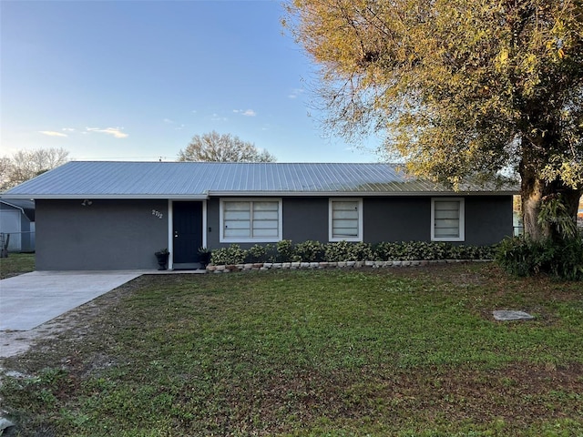 ranch-style home with a front yard