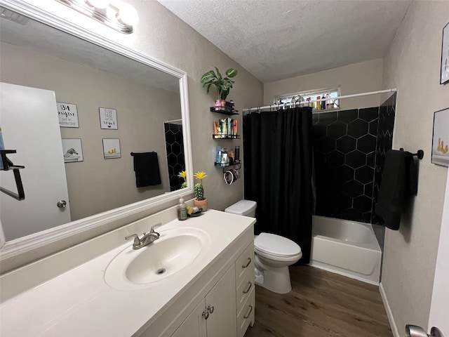 full bathroom featuring toilet, a textured ceiling, vanity, shower / bath combo, and hardwood / wood-style flooring