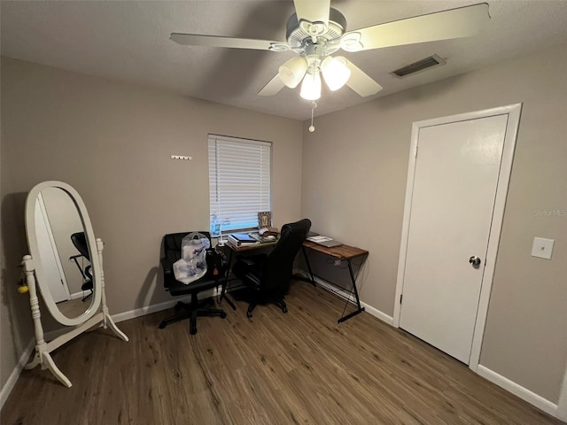 home office with hardwood / wood-style flooring and ceiling fan