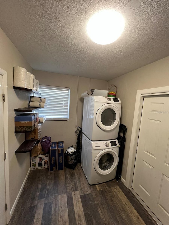 laundry room with stacked washer and dryer, dark hardwood / wood-style flooring, and a textured ceiling