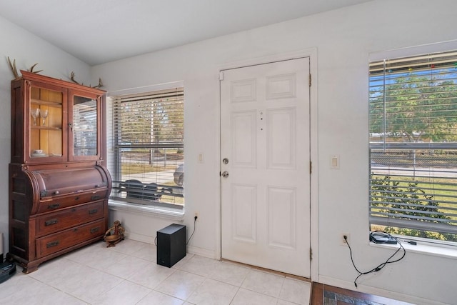 entrance foyer with light tile patterned floors