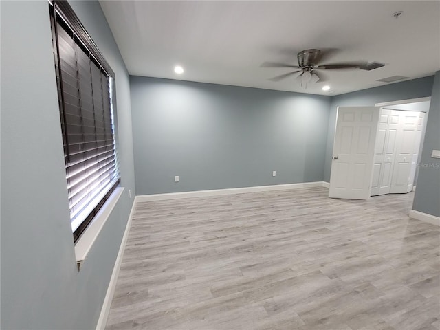 interior space with ceiling fan and light wood-type flooring