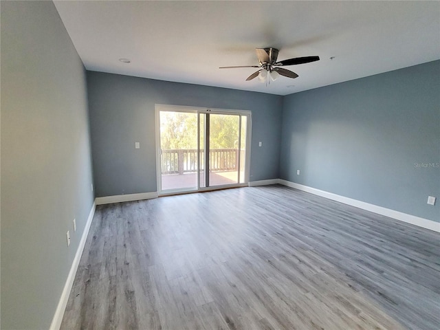 empty room with light hardwood / wood-style floors and ceiling fan