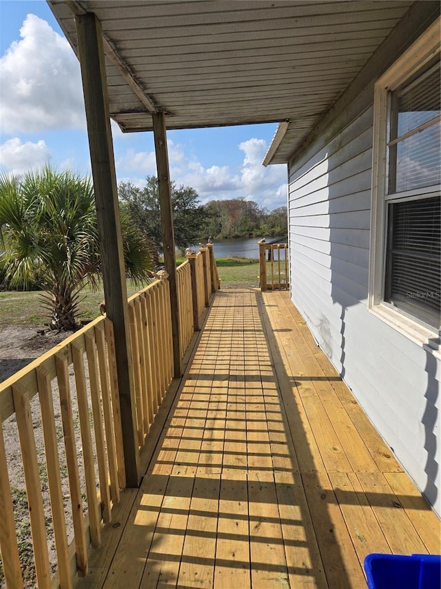 wooden deck with a water view