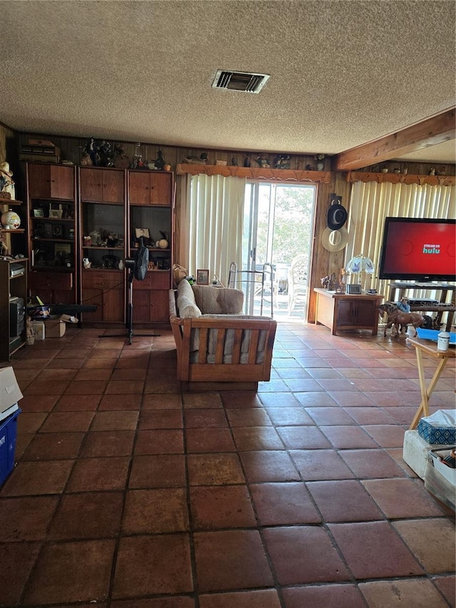 living room with a textured ceiling