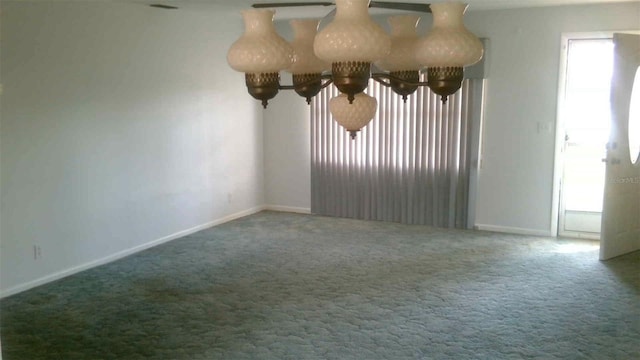 unfurnished room with carpet flooring