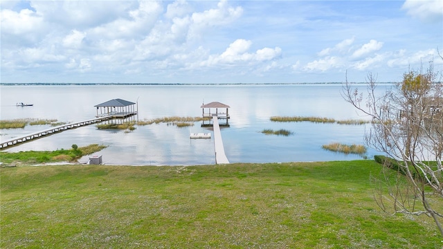 199 S Bear Pointe Dr, Lake Placid, FL 33852 - view of dock featuring a lawn and a water view