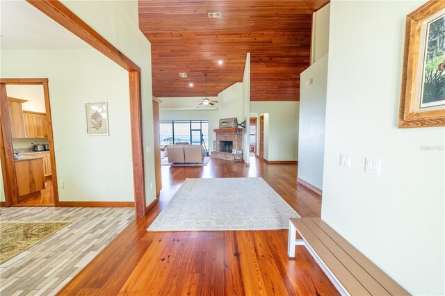 199 S Bear Pointe Dr, Lake Placid, FL 33852 - hallway featuring hardwood / wood-style flooring, high vaulted ceiling, and wooden ceiling