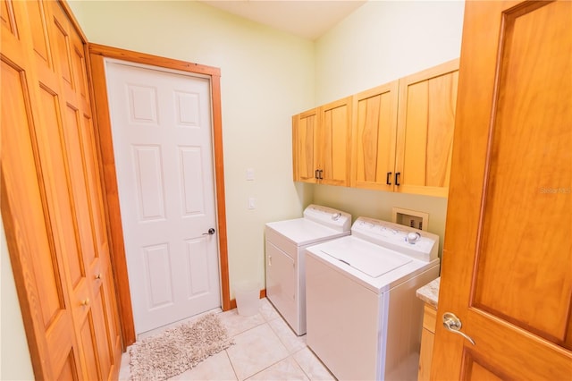 199 S Bear Pointe Dr, Lake Placid, FL 33852 - laundry room featuring washer and dryer, light tile patterned floors, and cabinets