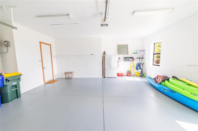 199 S Bear Pointe Dr, Lake Placid, FL 33852 - garage with white refrigerator