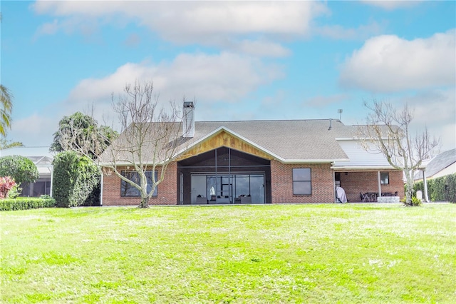 199 S Bear Pointe Dr, Lake Placid, FL 33852 - rear view of property with a yard