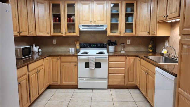 kitchen with white appliances, sink, decorative backsplash, and light tile patterned floors